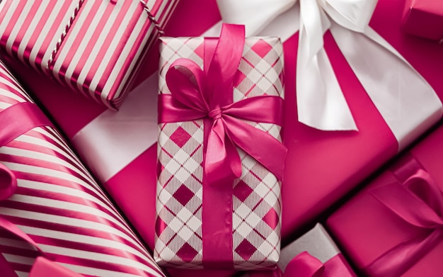 Holiday gifts and wrapped luxury presents pink gift boxes as\
surprise present for birthday christmas new year valentines day\
boxing day wedding and holidays shopping or beauty box\
delivery