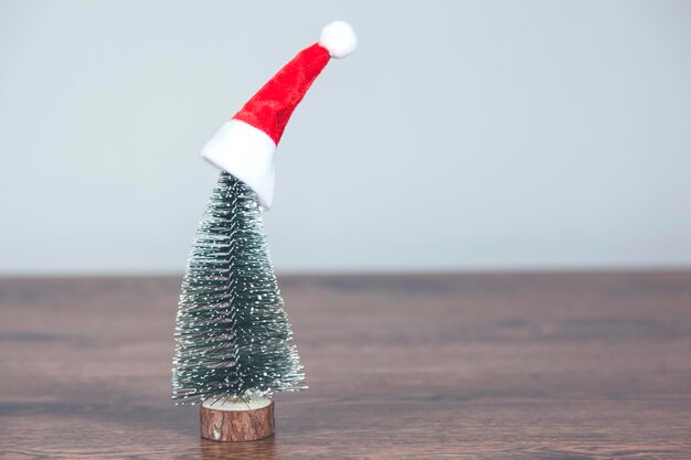 Holiday hat and chalkboard on desk