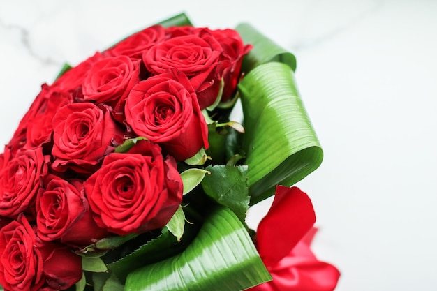 Holiday love present on Valentines Day luxury bouquet of red roses