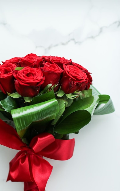 Holiday love present on Valentines Day luxury bouquet of red roses