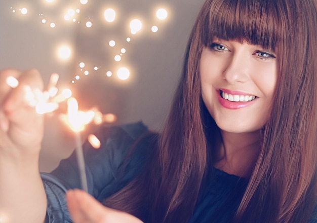 Holiday magic Christmas and New Year celebration happy woman with sparklers