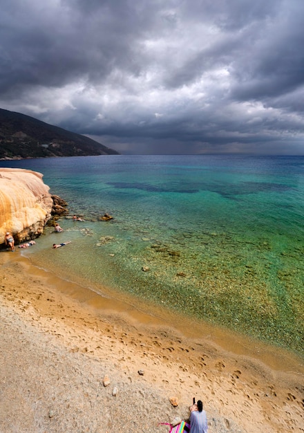 Holiday makers at hot springs at a Greek spa resort Loutra Edipsou, island Evia, Greece