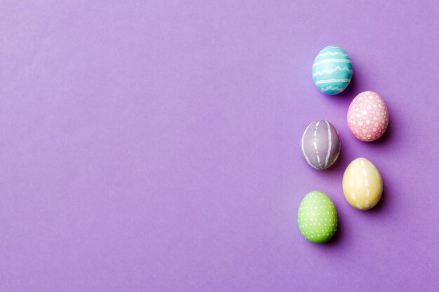 Holiday preparation multi colors easter eggs on colored background pastel color easter eggs holiday concept with copy space