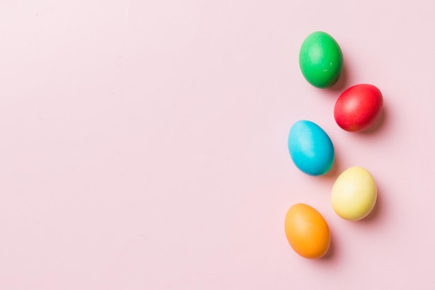 Holiday preparation Multi colors Easter eggs on colored background Pastel color Easter eggs holiday concept with copy space