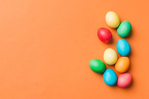 Holiday preparation Multi colors Easter eggs on colored background Pastel color Easter eggs holiday concept with copy space