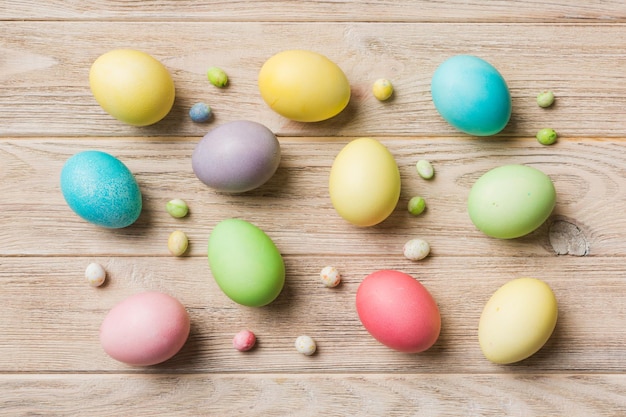 Holiday preparation Multi colors Easter eggs on colored background Pastel color Easter eggs holiday concept with copy space