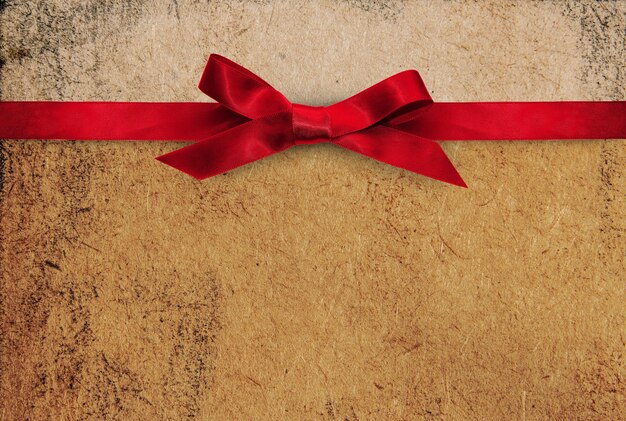 Holiday themed backdrop, red ribbon bow paper texture