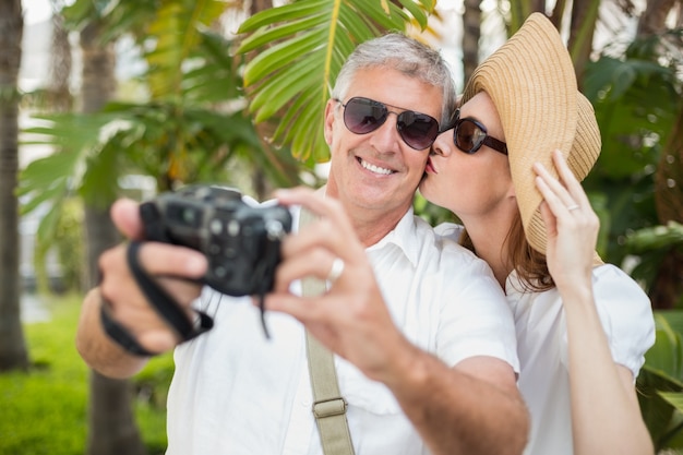 Holidaying couple taking a selfie