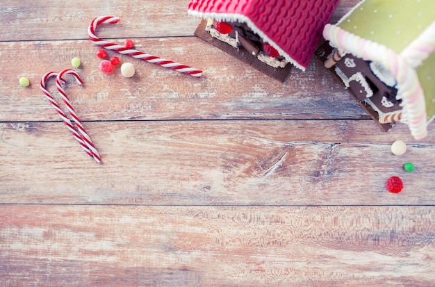 holidays, christmas, baking and sweets concept - closeup of beautiful gingerbread houses at home