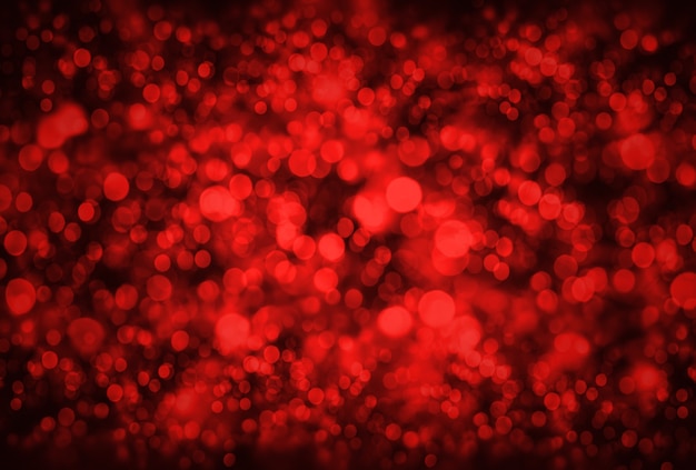 Holidays and design concept.  Abstract background. Image with blurred bokeh lights in trendy living coral color