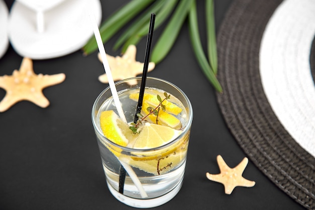 Holidays and drink concept. Cold cocktail, lemonade with lemon