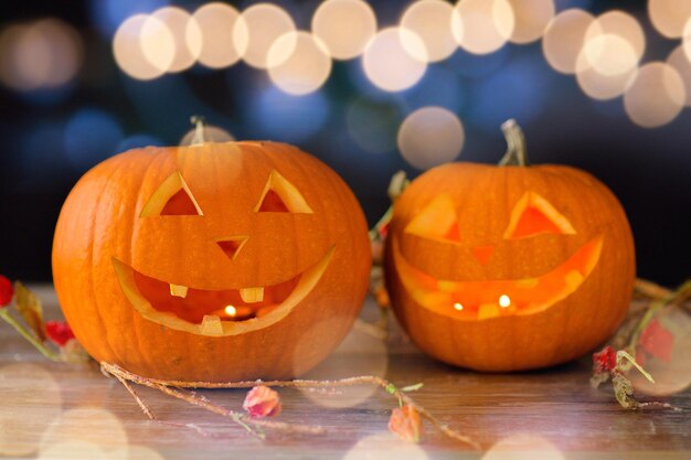 holidays, halloween and decoration concept - close up of pumpkins on table