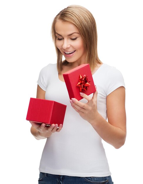 holidays, love and happiness concept - beautiful girl with gift box