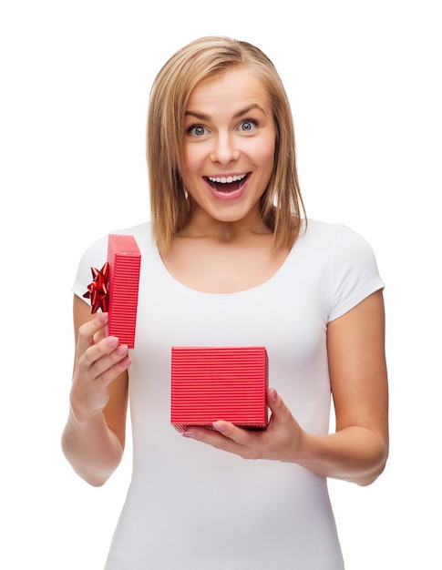 holidays, love and happiness concept - beautiful girl with gift box