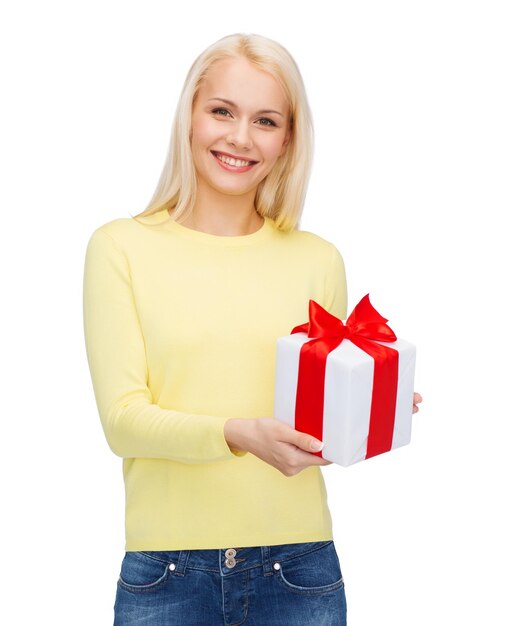 holidays, love and happiness concept - beautiful girl with gift box