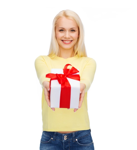 holidays, love and happiness concept - beautiful girl with gift box