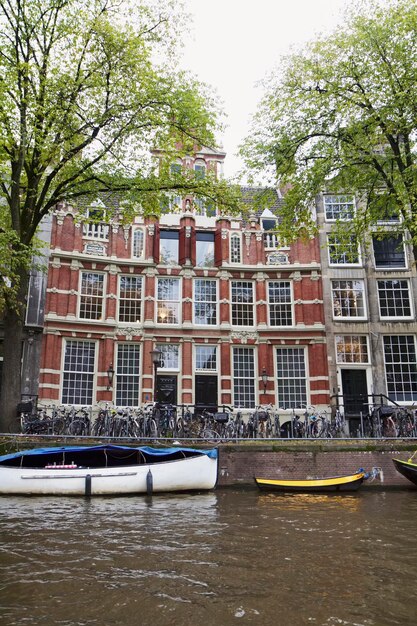 Holland, Amsterdam; 10 October 2011, old stone houses on a water channel - EDITORIAL