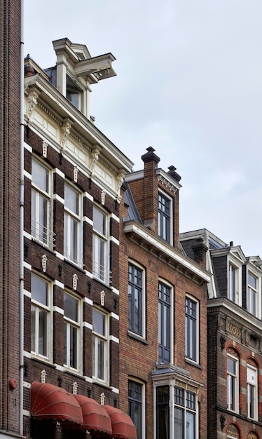 Holland, Amsterdam, the facade of old private stone houses downtown