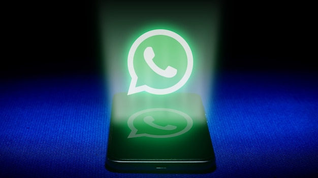 Hologram of whatsapp logo. hologram whatsapp logo image on blue background .