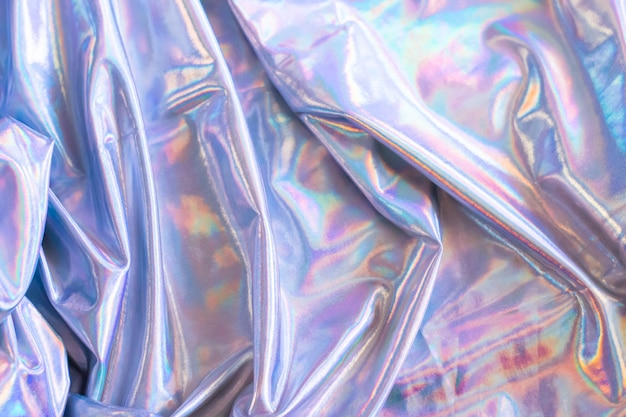 holographic iridescent mermaid foil texture background. futuristic neon trendy silver colors