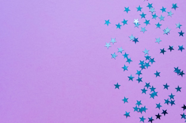 Holographic stars on trendy purple background. 