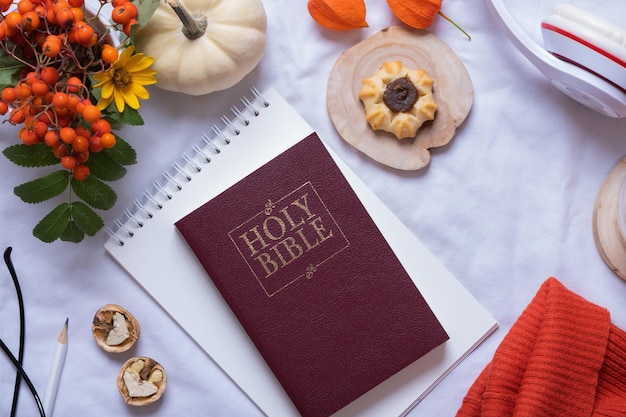 Holy Bible and autumn cozy decor top view Bible study fall concept