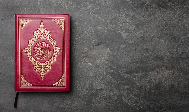 Photo holy book of muslims on gray background