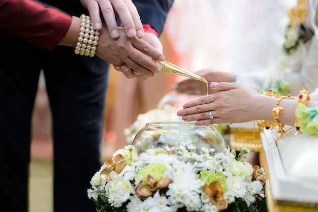 Holy water pouring ceremony for bride and groom Thai wedding engagement