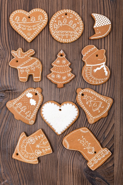 Home-baked and decorated gingerbread on wooden background. Christmas Gingerbread.