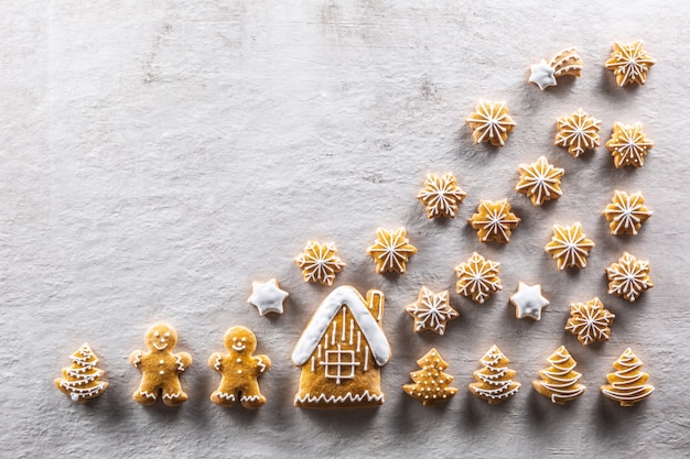 Home-baked gingerbreads arranged in a fairytale Christmas atmosphere - copy space.