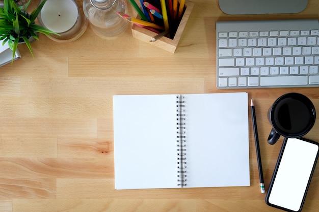 Home business office desk with communication device and office supplies.