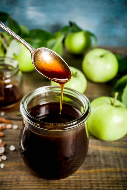 Home cooked dark salted classic caramel sauce, with green apples