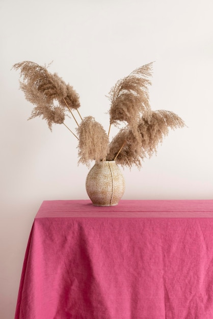 Home decor concept table with pink tablecloth