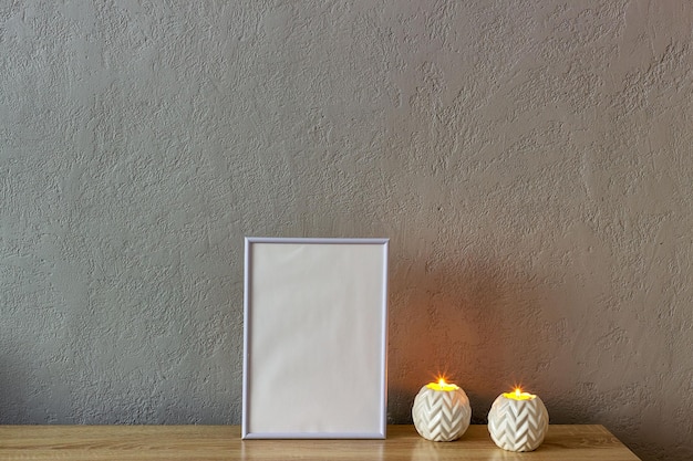 Home decor mockup blank photo frame near gray painted concrete wall Place for your text