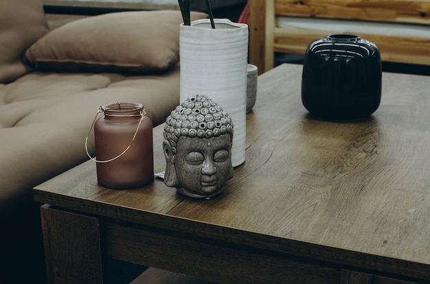 Home decor with buddha head on table