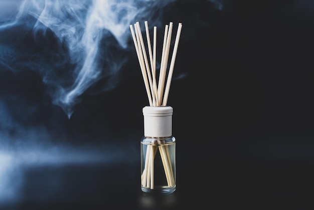 Home fragrance diffuser on dark background Wellness and spa concept