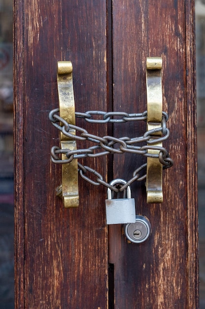 Home front door chained shut and locked with a chain an
padlock