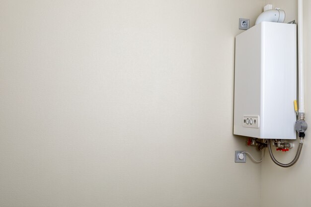 Home gas boiler, water heater. Isolated gas stove on a gray background.