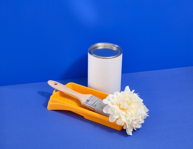 Home improvement and repair concept Roller tray and paint brush Nice flower