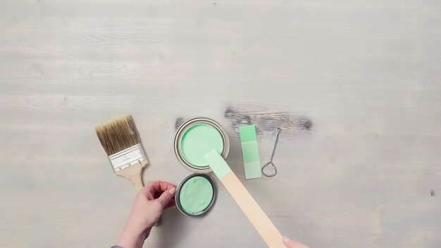 Home inprovement project. Painting wood with turquose color paint.