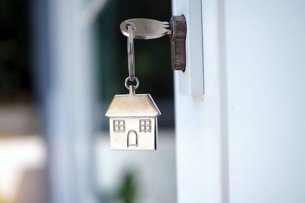 Photo home key for unlocking the new house door. renting, buying, selling houses