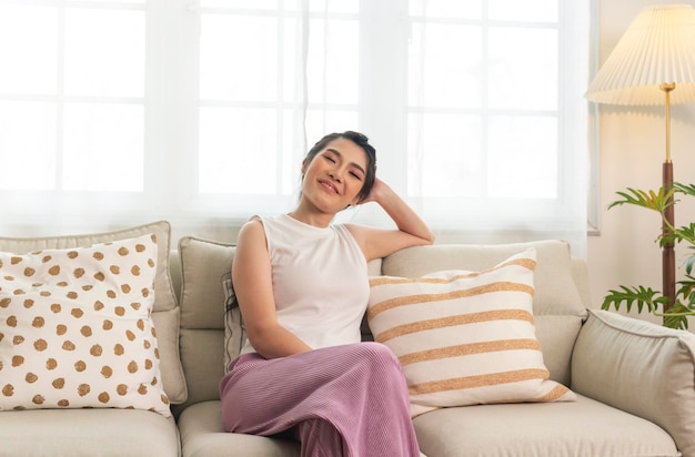 Home lifestyle asian woman relaxing on sofa in living room