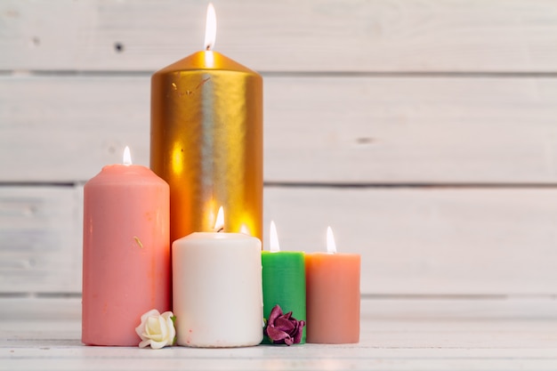 Home lighting candles on wooden table