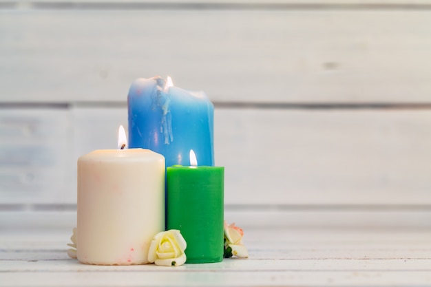 Home lighting candles on wooden table