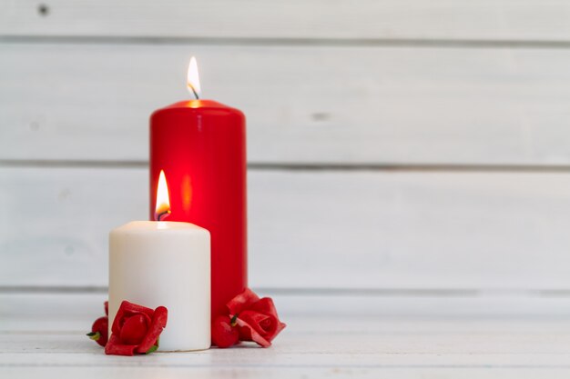 Home lighting candles on wooden table