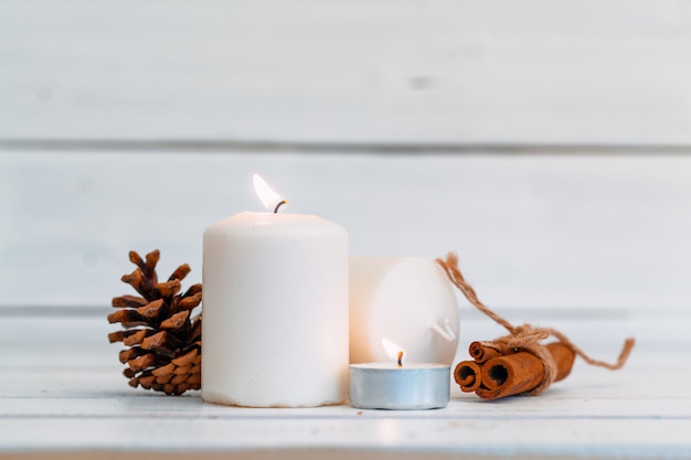 Home lighting candles on wooden table