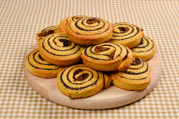 Home made baked cookies with raisins and poppy seeds. Space for text or design.