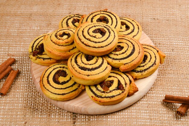 Home made baked cookies with raisins and poppy seeds. Space for text or design.