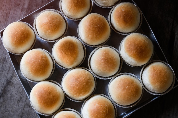 Home made baked round white breads with nature lighting.