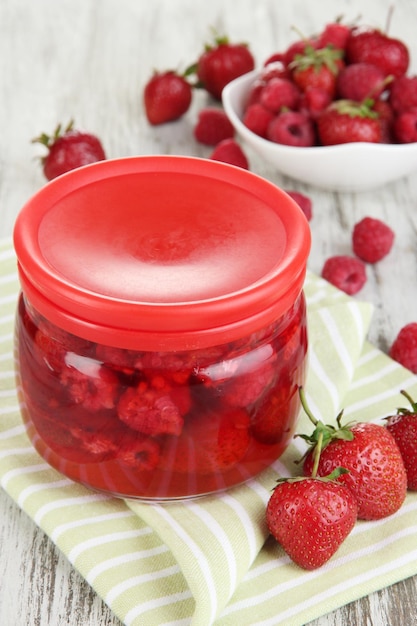 Home made berry jam on wooden table